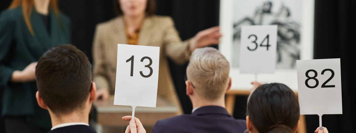 Do Incentivized Fundraising Auctions Raise More Money? How?